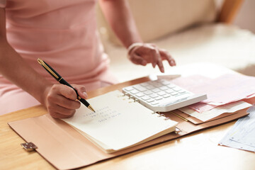 Woman Calculating Expences