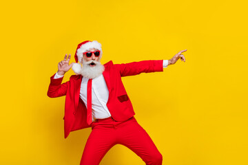 Fototapeta na wymiar Portrait of excited cheerful aged person make moves dancing good mood isolated on yellow color background