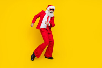 Fototapeta na wymiar Full length photo of funky cool claus wear red tux costume having fun disco dancing empty space isolated yellow color background