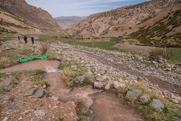 trekkers on the route to Azib Ikkis,  M Goun trek, Atlas mountain range, morocco, africa