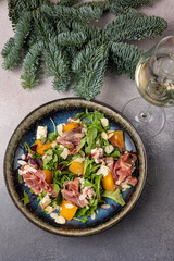 Merry Christmas. delicious salads on a gray background
