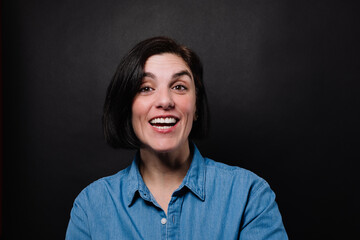 studio portrait of a cheerful woman