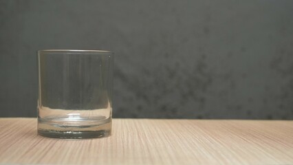 Empty glass on table