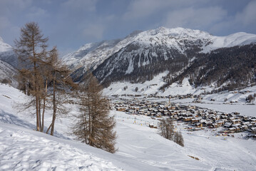 Fototapeta na wymiar Panorama Town of Livigno in winter. Livigno landscapes in Lombardy, Italy, located in the Italian Alps, near the Swiss border.
