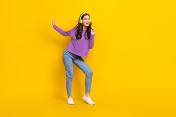 Fototapeta na wymiar Full size of pretty positive girl listen new playlist sing arm imagine microphone isolated on yellow color background
