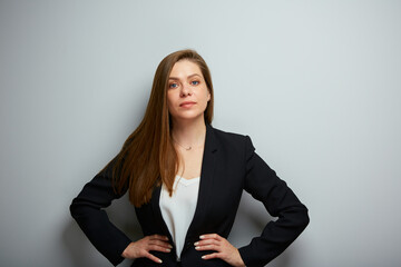 Serious business woman in black suit isolated portrait.