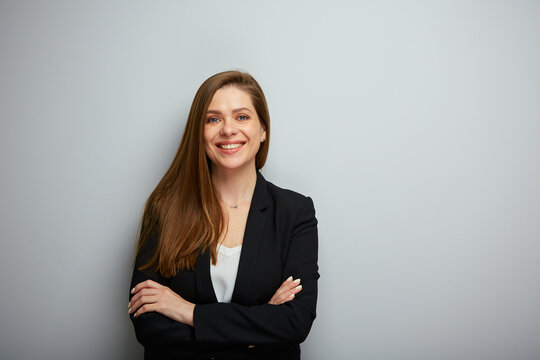 Smiling business woman crossed arms, isolated portrait.