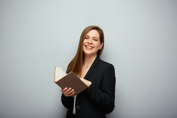 Smiling woman teacher reading book. Isolated portrait with copy space.