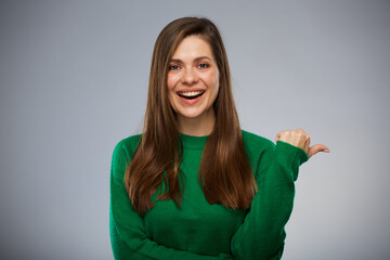 Smiling woman in green showing thumb up. Isolated advertising portrait. - 552021207