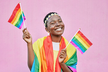 Black woman, flag and pride with lgbtq portrait, freedom and support queer community with happiness...