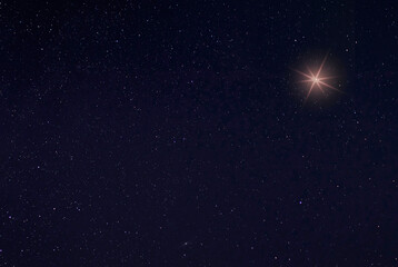 Single bright star in the sky on Christmas Eve