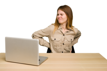 Young caucasian woman in a workplace working with a laptop isolated suffering a back pain.