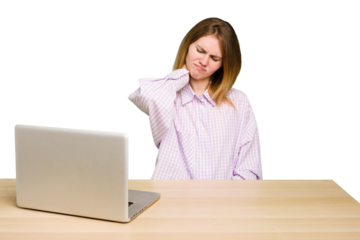 Young caucasian woman in a workplace working with a laptop isolated suffering neck pain due to sedentary lifestyle.