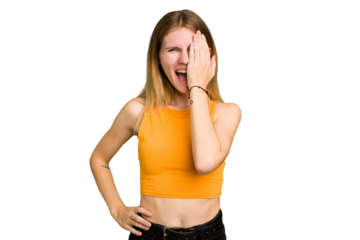Young caucasian woman isolated having fun covering half of face with palm.