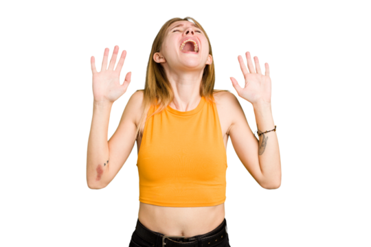 Young caucasian woman isolated screaming to the sky, looking up, frustrated.