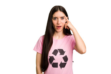 Young caucasian woman wearing a recycling t-shirt isolated showing a disappointment gesture with...