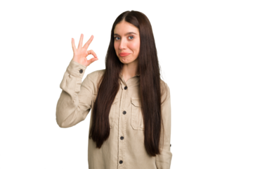 Young caucasian brunette long hair woman cutout isolated winks an eye and holds an okay gesture with hand.
