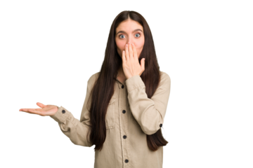 Young caucasian brunette long hair woman cutout isolated impressed holding copy space on palm.