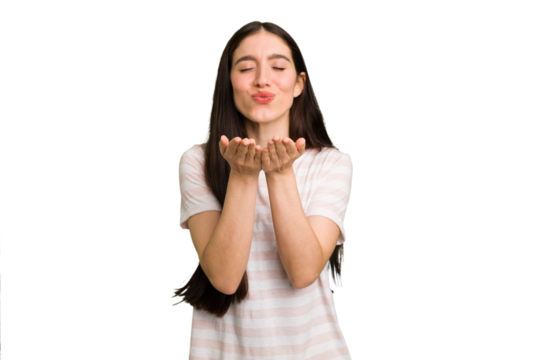 Young caucasian brunette long hair woman cutout isolated folding lips and holding palms to send air kiss.
