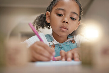 Student, child learning and writing in notebook for development, fine motor skills and home...