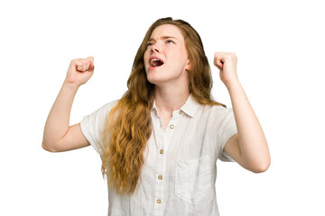 Obraz premium Young caucasian redhead woman isolated raising fist after a victory, winner concept.