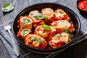 tasty chicken rollatini in tomato sauce, top view