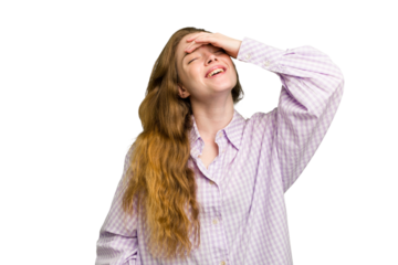 Young caucasian redhead woman isolated laughs joyfully keeping hands on head. Happiness concept.