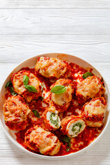 tasty chicken rollatini in tomato sauce, top view