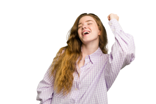 Young caucasian redhead woman isolated celebrating a victory, passion and enthusiasm, happy expression.