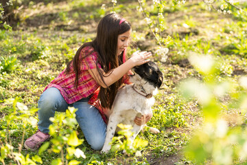 Naklejka na ściany i meble little girl with a dog, outdoor summer