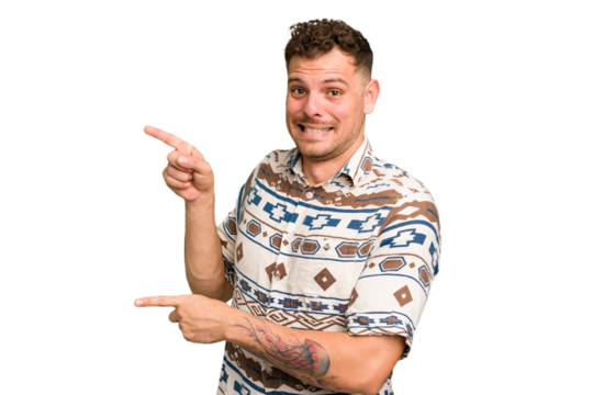 Young caucasian handsome man isolated shocked pointing with index fingers to a copy space.