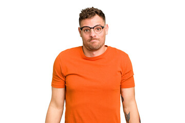 Obraz premium Young caucasian handsome man isolated shrugs shoulders and open eyes confused.