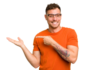 Young caucasian handsome man isolated excited holding a copy space on palm.