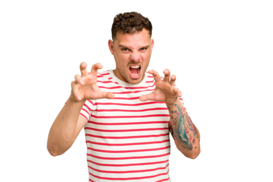 Young caucasian handsome man isolated showing claws imitating a cat, aggressive gesture.