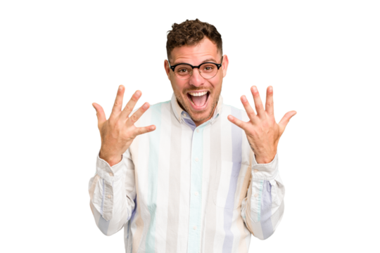 Young caucasian handsome man isolated showing number ten with hands.