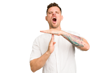 Young caucasian handsome man isolated showing a timeout gesture.