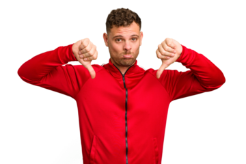 Young caucasian handsome man isolated showing a dislike gesture, thumbs down. Disagreement concept.