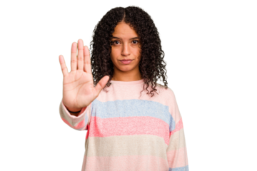 Young Brazilian curly hair cute woman isolated standing with outstretched hand showing stop sign, preventing you.