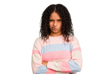 Young Brazilian curly hair cute woman isolated frowning face in displeasure, keeps arms folded.