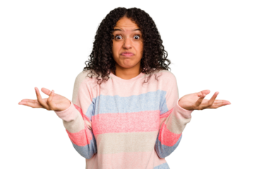 Young Brazilian curly hair cute woman isolated doubting and shrugging shoulders in questioning gesture.
