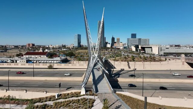 I-35 traffic at Skydance Bridge with Oklahoma City skyline in distance. Aerial view.