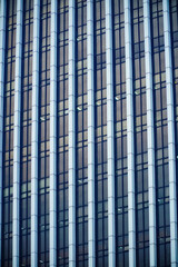 blue glass facade of skyscraper. building windows texture