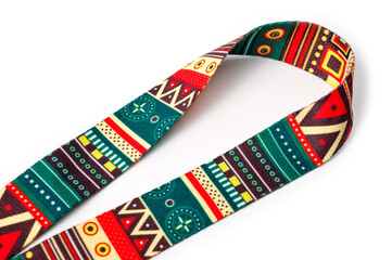 Neck strap in bright abstract neoprene for comfortable ukulele playing.