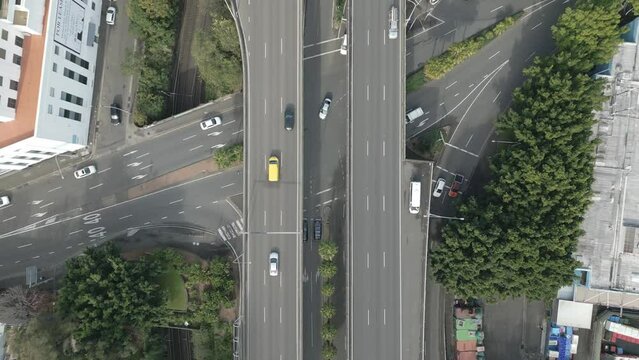 Aerial top down of traffic flowing the Sydney city cbd establishing shot. Directly looking down bird eye view