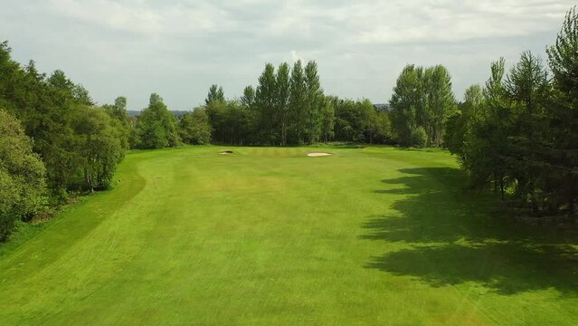 Drone Shot on Golf Course Par 3, Low Fly of Ball Trajectory and Panning Around Pin on the Green