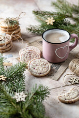 Obraz na płótnie Canvas Fresh baked cranberry cookies with cup of coffee . Christmas decoration with fir branches, beige tile background