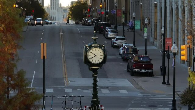 Downtown Tulsa Oklahoma long aerial zoom of clock and traffic in city street. Long aerial zoom.