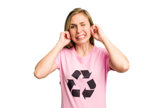 Young caucasian woman wearing a recycling t-shirt isolated covering ears with hands.