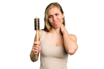 Young caucasian woman using an hair comb isolated touching back of head, thinking and making a choice.