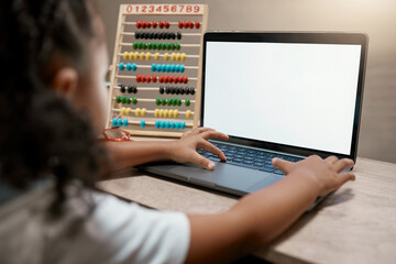 Laptop, elearning and girl in homeschool math class with green screen or mockup online classroom. Education, internet and video streaming service for kindergarten child development for home school.